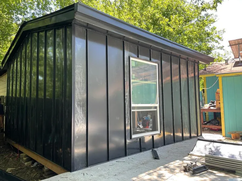 Black standing seam metal wall panels for Metal Roof Installation in New Smyrna Beach