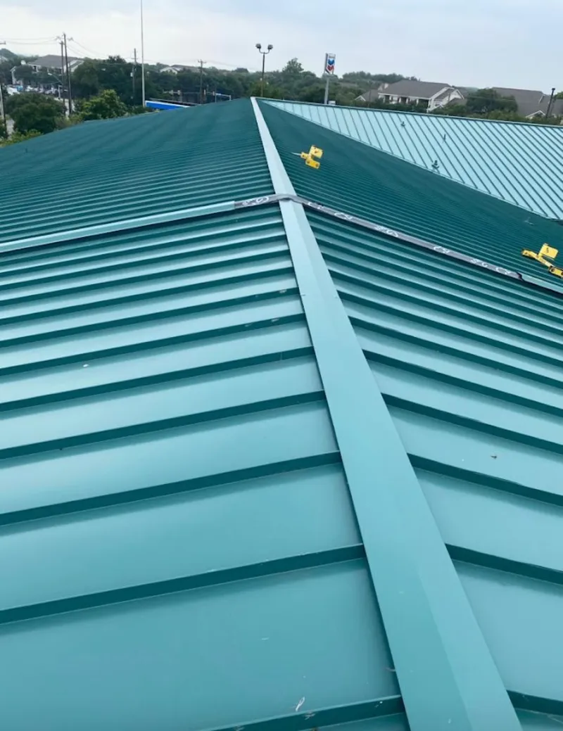Green commercial metal roof ridge and valley for Metal Roof Repair in New Smyrna Beach